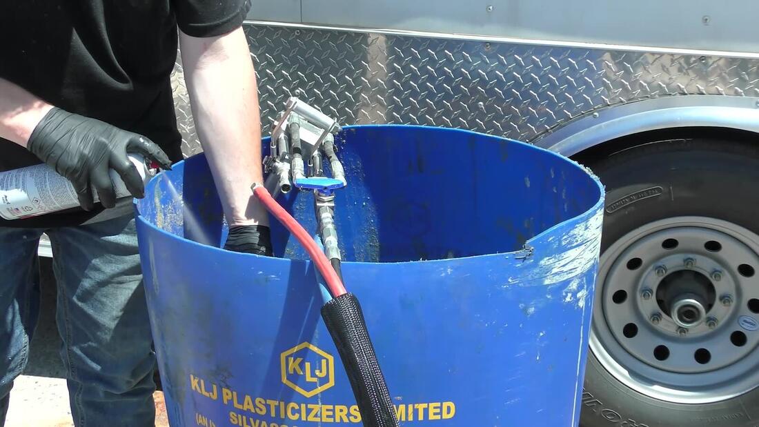 Gun soaking in solvent drum