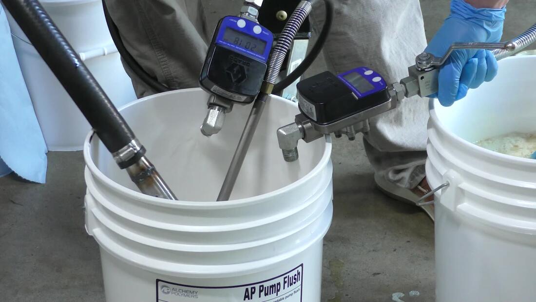 Flow meter and gun over flush bucket