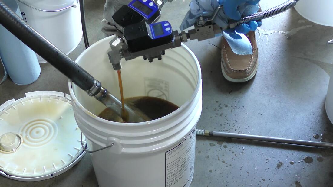 Flush fluid running into a pail
